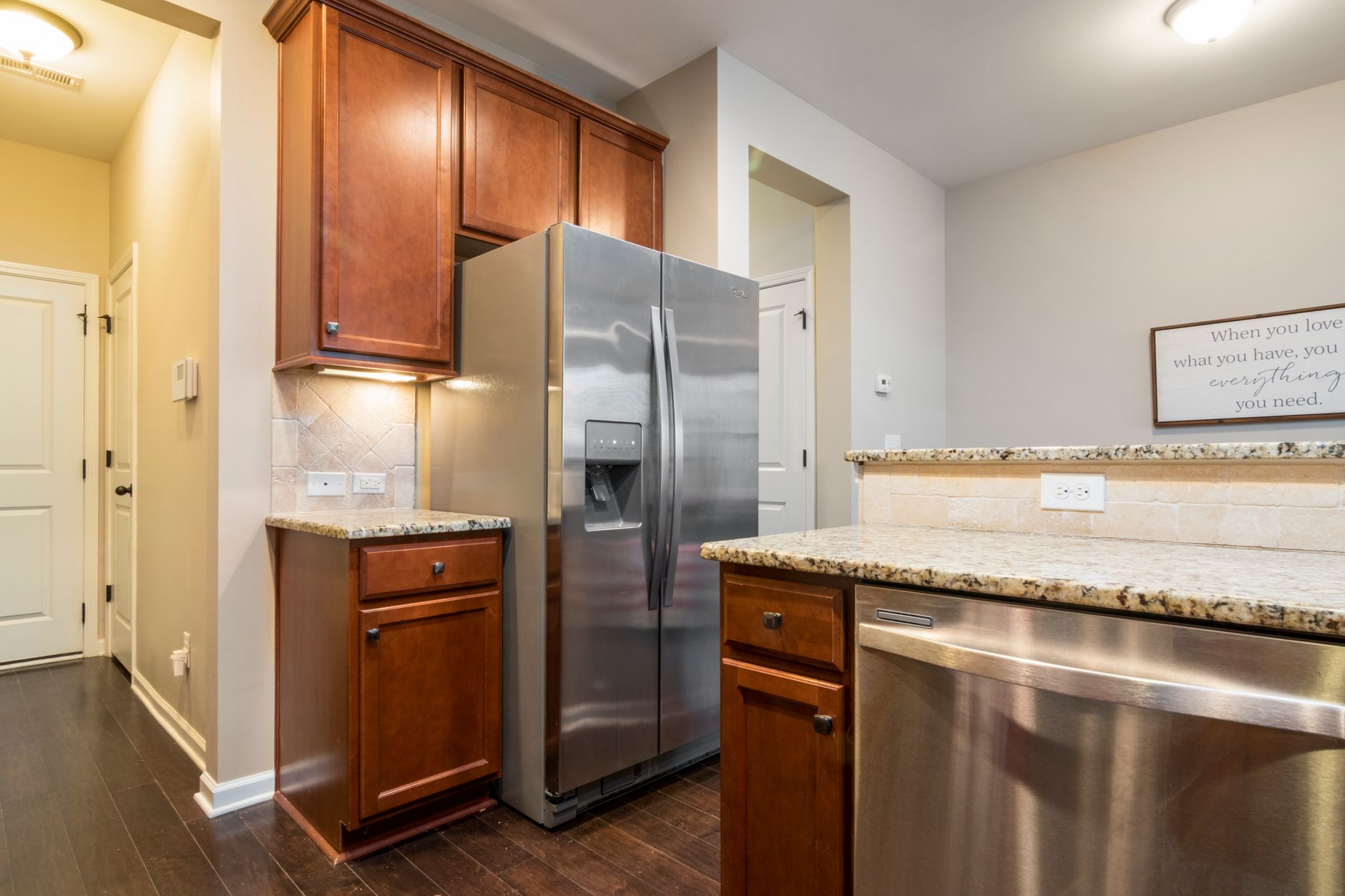 Elegant kitchen interior featuring stainless steel appliances and wooden cabinets in Austin, TX